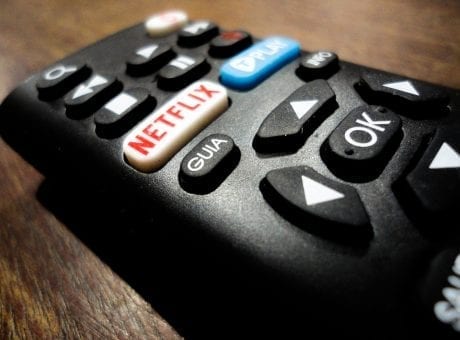 close up of remote control with netflix button