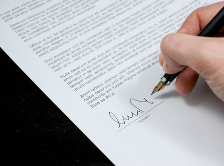 hand signing a document