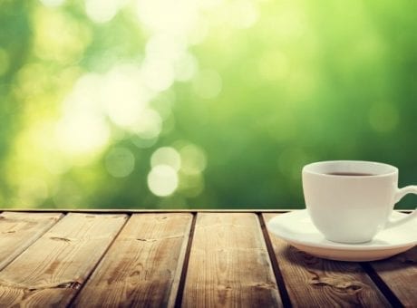 cup of coffee on wooden table