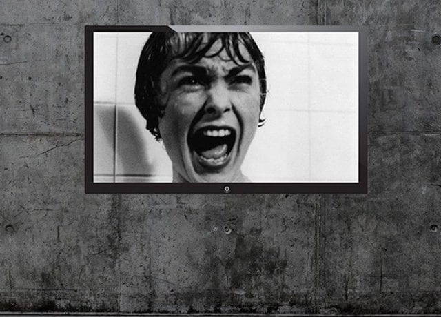 person screaming on tv screen black and white