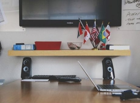 desk with laptop and flags