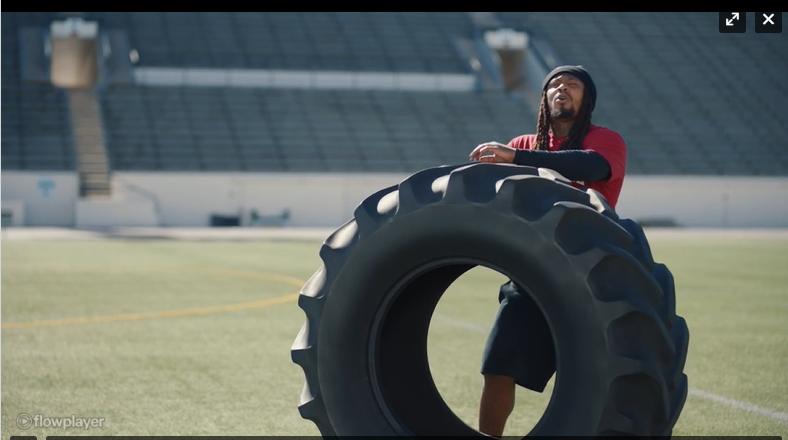 subway ad athlete flipping large tire
